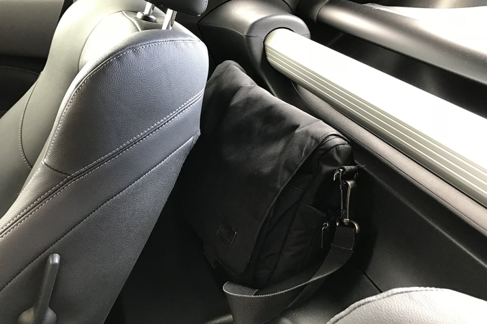 There are two lined recesses for soft bags or coats behind each seat. (image: James Cleary)