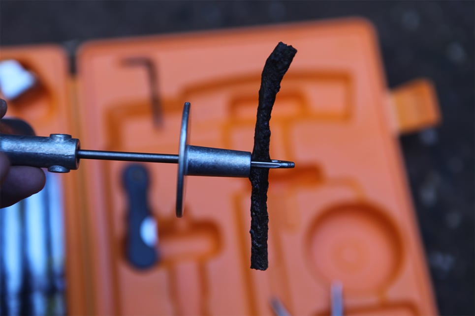 Thread a length of repair cord through the eye of the insertion tool.