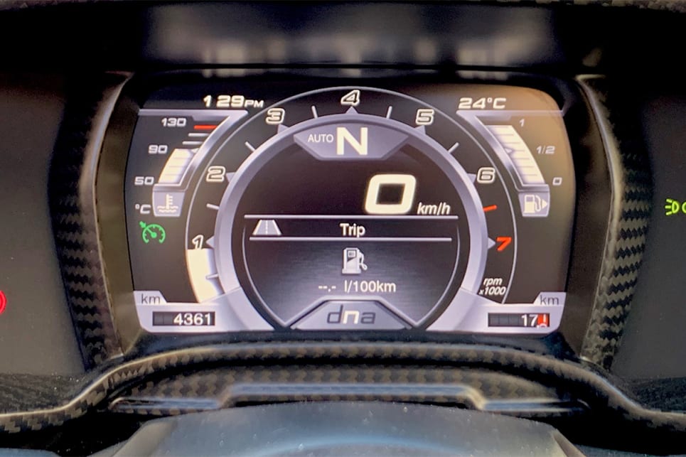 In front of the driver is a digital instrument cluster.