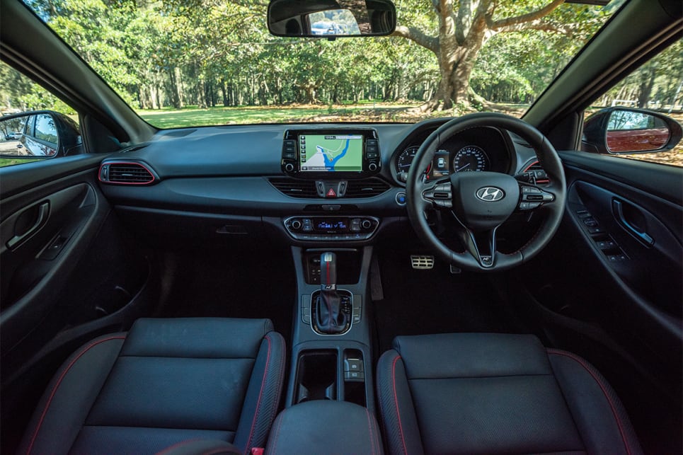 Inside, the i30 ups the sporty stakes with snazzy red seat belts and that red-metal trim around the air vents.