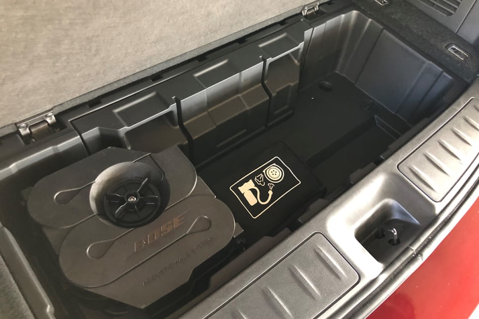 Underneath the boot floor is the amp for the Bose sound system and the tyre inflation kit.