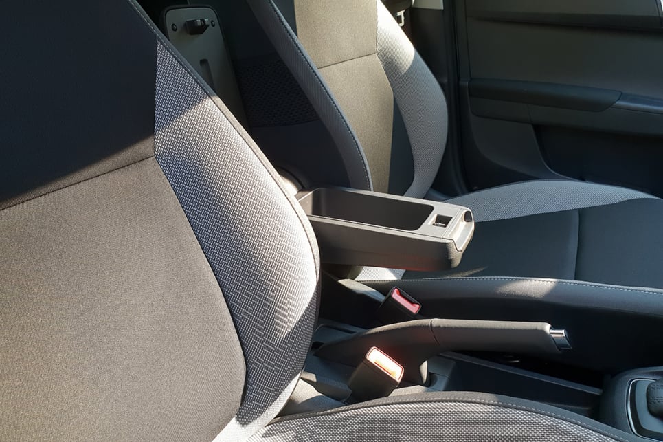 While the Fabia's optional armrest can hold phones and wallets, it comes as an expensive optional extra.