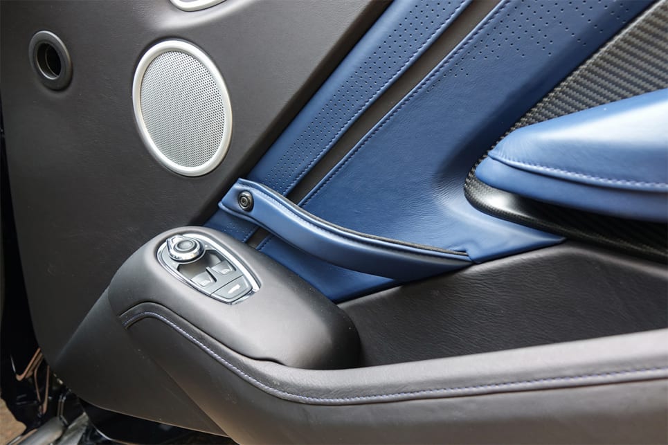 The blue and black leather continues onto the doors and there are also carbon fibre door inserts.