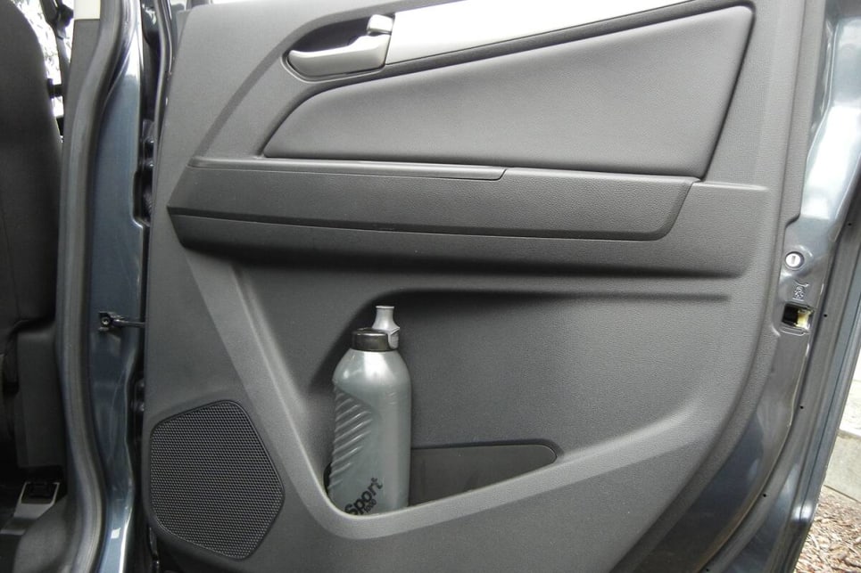 Rear seat passengers only get a bottle holder and small storage bin in each rear door. (image: Mark Oastler)