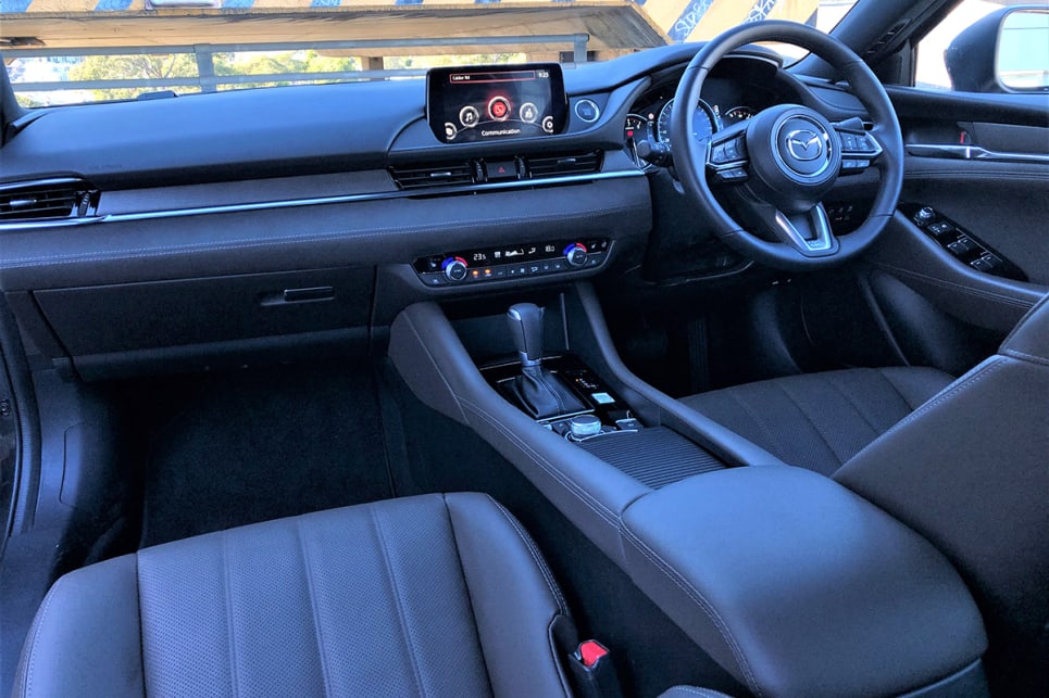 If there are any criticisms it's that the cabin is feeling dated compared to the cockpit of the new-generation Mazda3. (image: Richard Berry)
