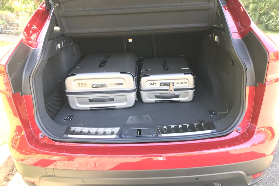 The F-Pace's boot easily swallowed the CarsGuide suitcases. 