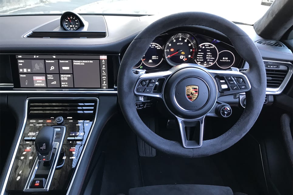 The cabin has a strong hint of 911, especially the instrument cluster.