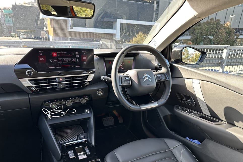 The C4’s also different with its steering wheel, which has a flat bottom – and top. (Image: Justin Hilliard)