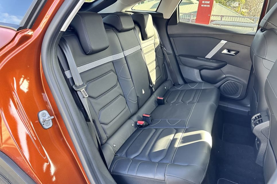 In the second row, there are map pockets on the front seat backrests and door bins that can swallow a large bottle apiece. (Image: Justin Hilliard)