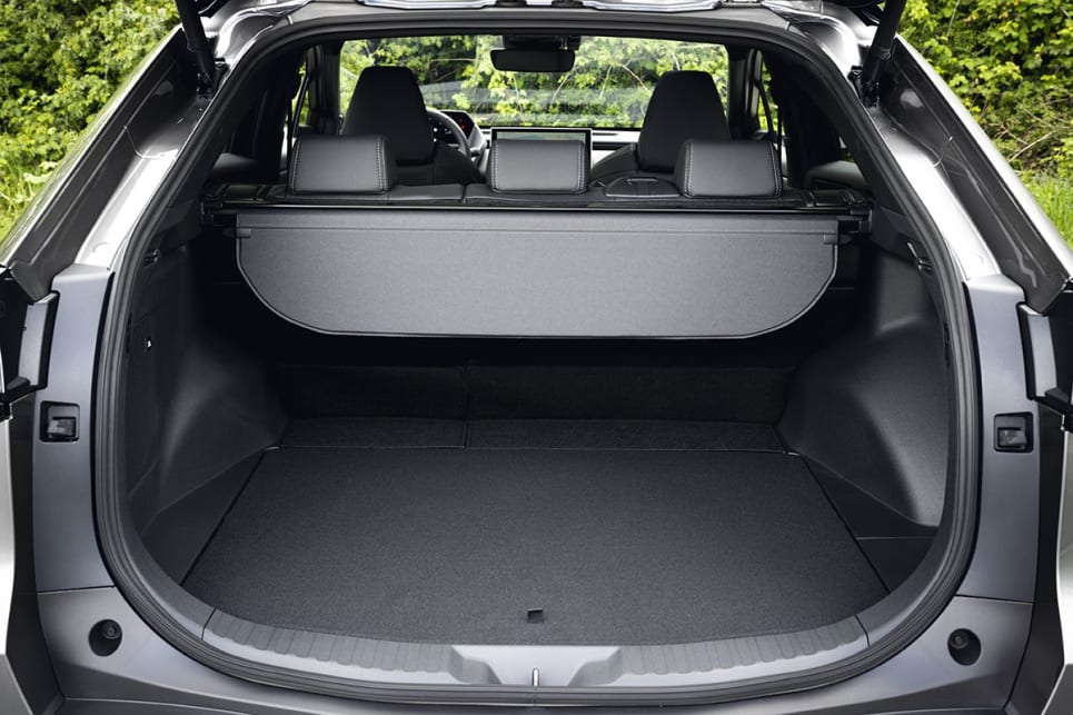 The cargo area features a luggage cover.