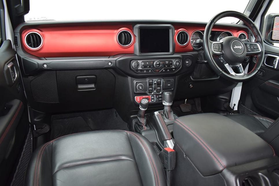The interior includes ample black leather with contrasting red-stitching. (image: Mark Oastler)