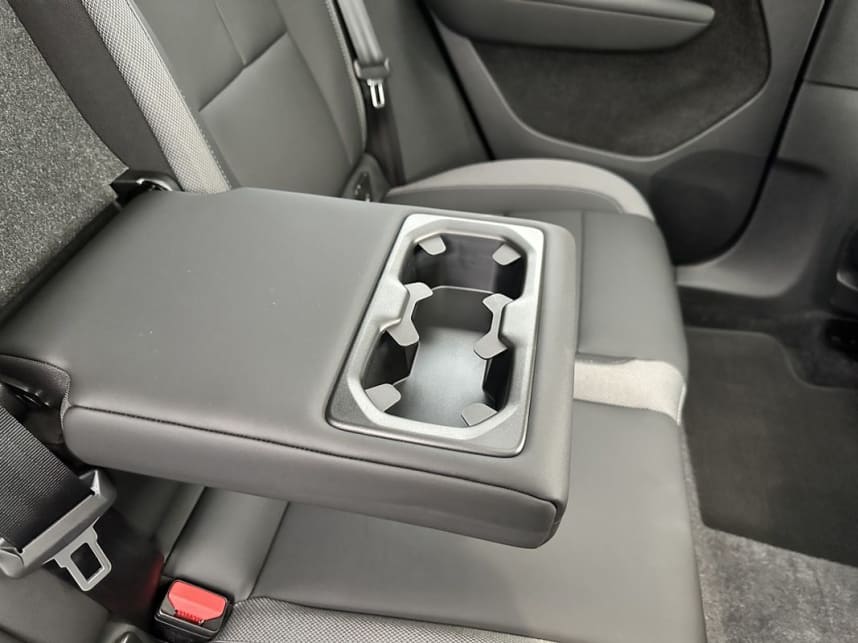 Speaking of which, map pockets are attached to the front seat backrests, while the fold-down armrest has two cupholders. (image: Justin Hilliard)