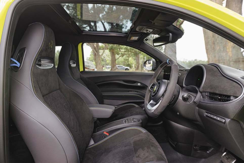 Inside, there’s a leather-and-Alcantara steering wheel and sports seats. (Image: Andrew Chesterton)