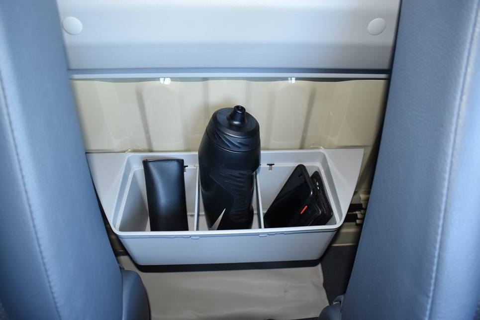 A large storage bin with internal dividers is mounted on the cabin’s rear bulkhead between the seats. (image: Mark Oastler)
