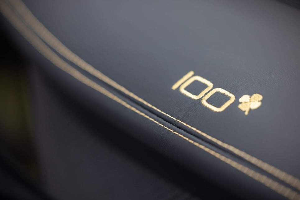 Including across the dashboard with a ‘100’ stitched ahead of the front seat passenger seat.