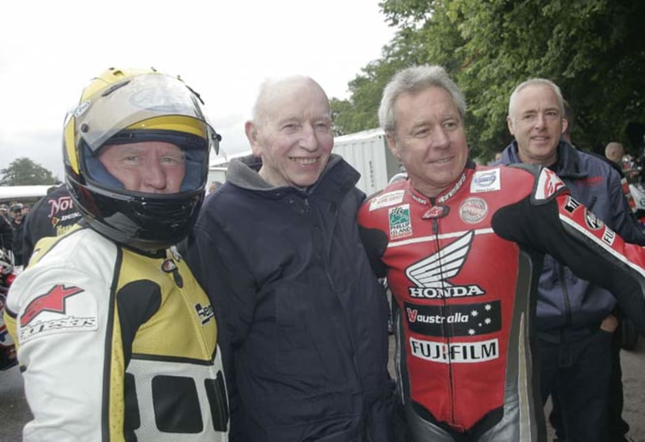 Australian motorbike legends Wayne Gardner and Troy Corser swapping wheelie tips with Sir John Surtees, the only person to win both motorcycle and F1 world championships.