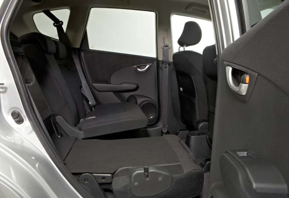 With all seats folded flat it has a massive flat cargo floor that can swallow a mountain bike with ease, largely because the petrol tank is under the front seats.