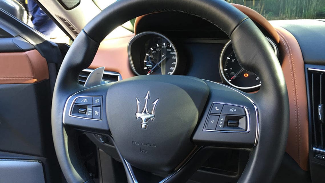 2017 Maserati Levante trident-badged steering wheel.