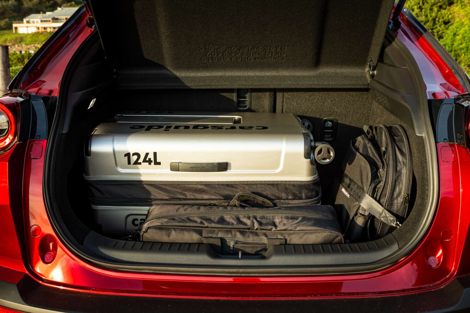 With the cable bags strapped in place, the boot fit our largest (124L) CarsGuide travel case with little extra room to spare. (image: Tom White)