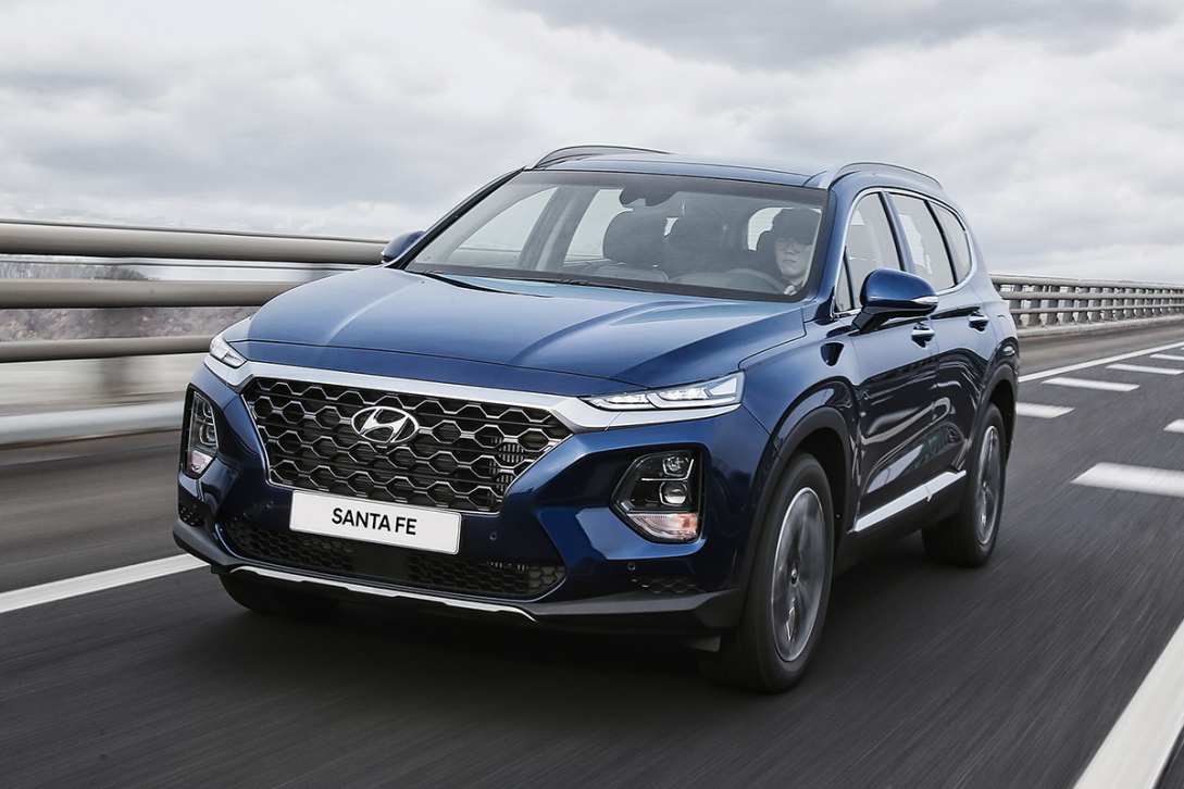 Hyundai product executives confirmed a hybrid version of the Santa Fe will arrive when the car gets its mid-life update.