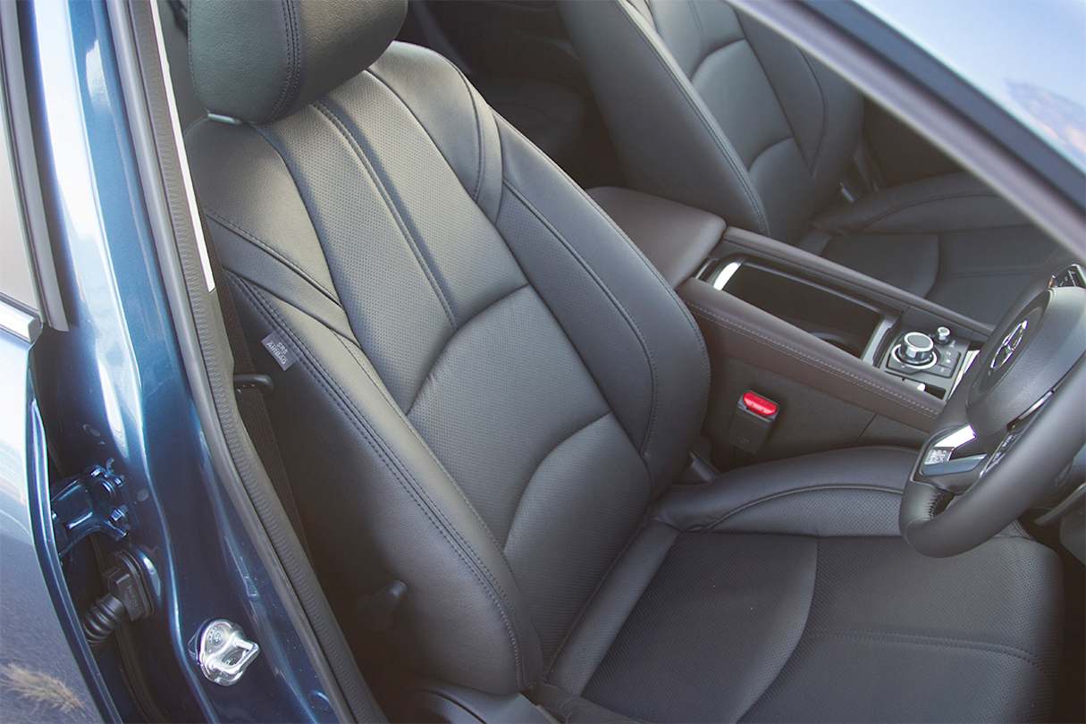 The Mazda 3 Touring picks up leather seats.