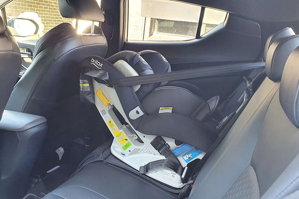 Once the car seat is in place, room up front is tight.