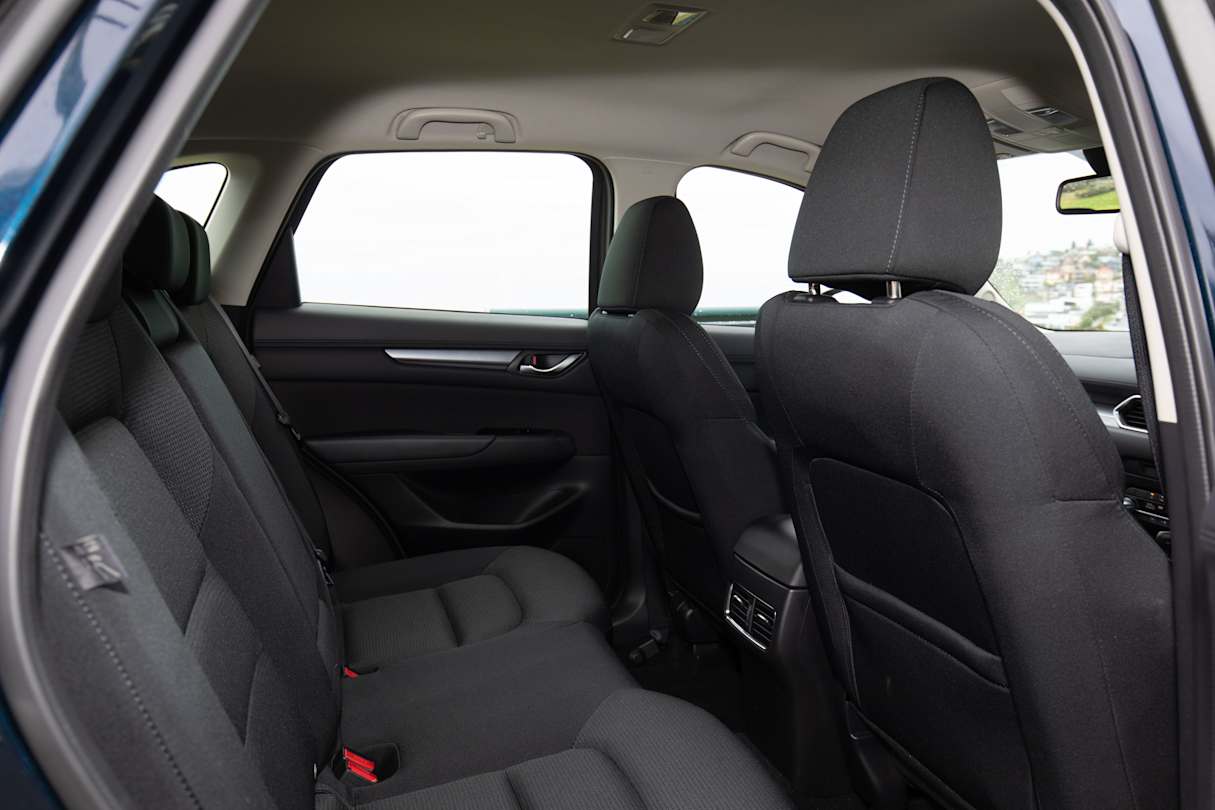 Kids will fit fine in the back, but taller adults might have some issues as it's not hugely spacious in the back seat.