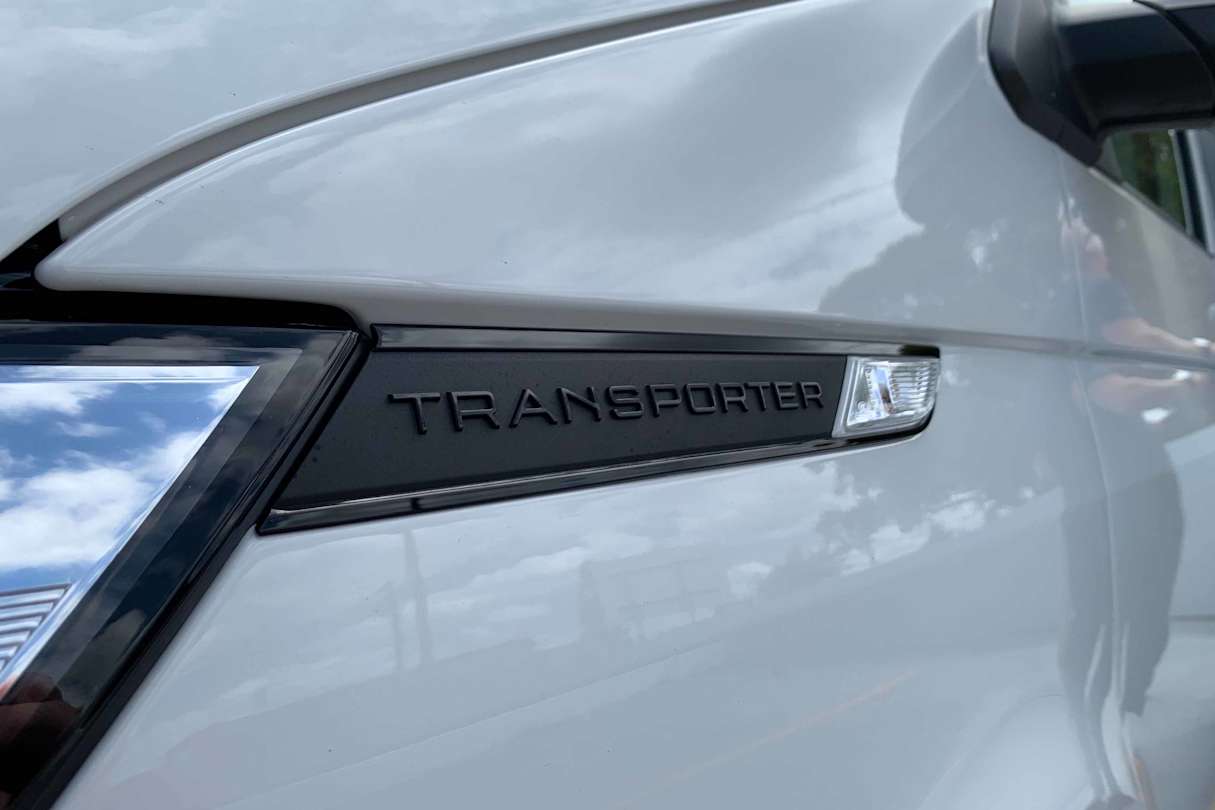 The distinct little lines that run back from the headlights that say “Transporter” in them are a nice design touch.
