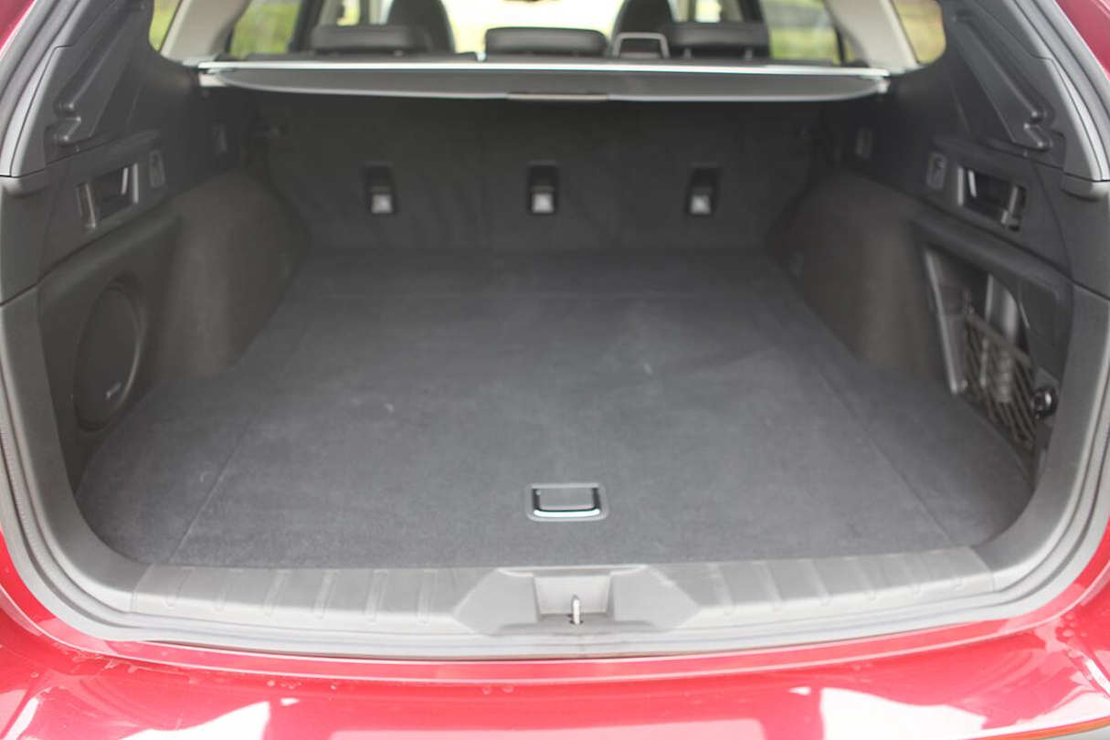 The Subaru Outback AWD Touring's cargo capacity, with five seats in use, is listed as 522 litres.