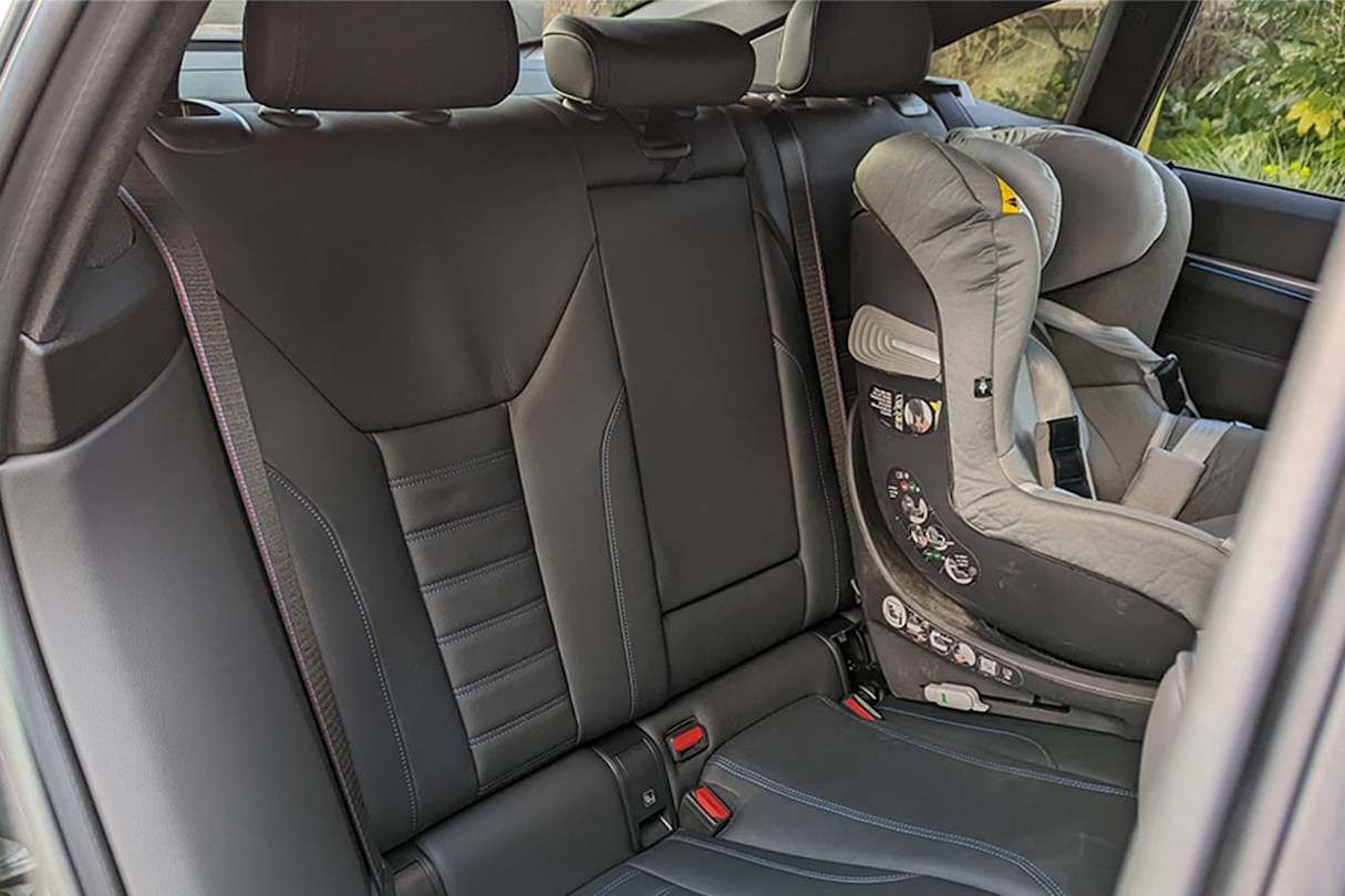 In the second row, passengers can make use of the climate controls, USB-C charging ports and a fold-down-centre armrest with two cupholders. (Image: Tung Nguyen)