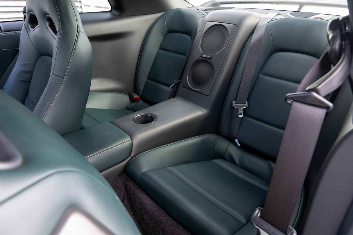 In the rear there are two seats bisected by a centre console that runs the length of the cabin (Image: Joel Strickland).