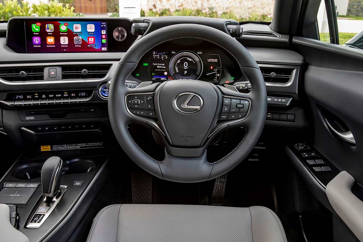 The steering wheel is heated with a power-adjustable column (pictured: UX 300e Luxury).