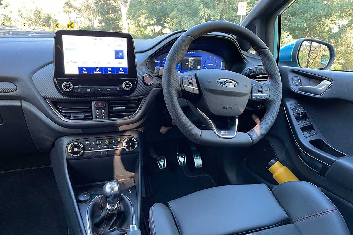 The Fiesta ST comes with a leather-wrapped heated steering wheel, an 8.0-inch touchscreen with Apple CarPlay/Android Auto, and much more. (image: Tim Nicholson)