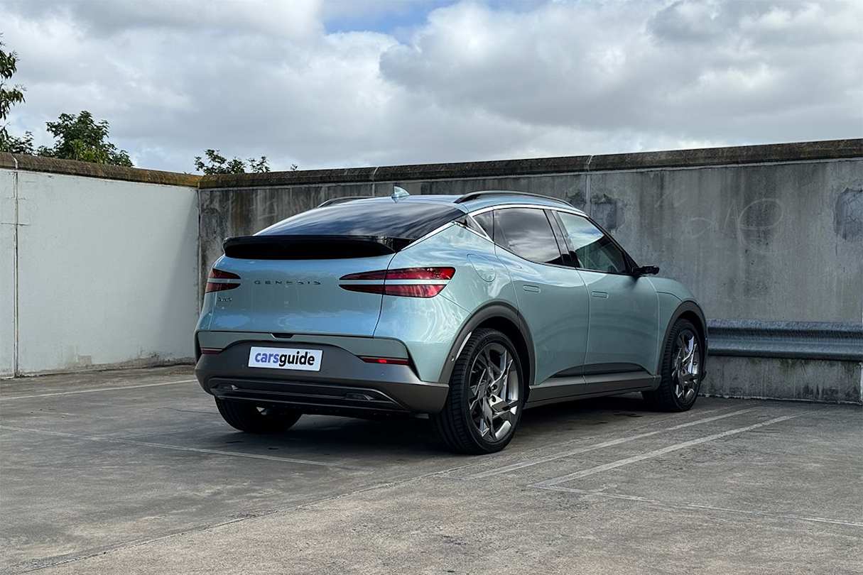 Around the side, the GV60 shows off its shapeliness even more, with its windscreen proving steeply raked, while its roofline gradually slopes to fulfil the coupe-style brief, with blacked-out pillars to boot.