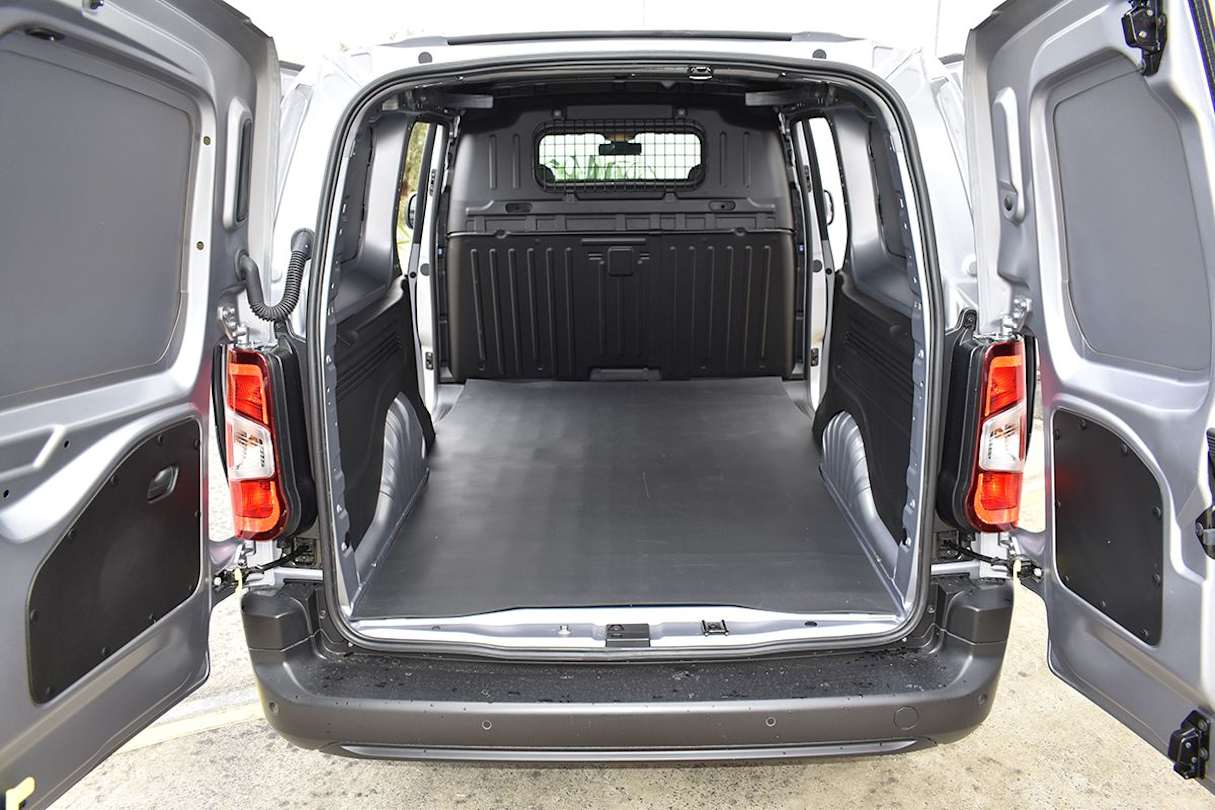 A sealed metal bulkhead with central window separates the cabin and cargo bay. (Image: Mark Oastler)