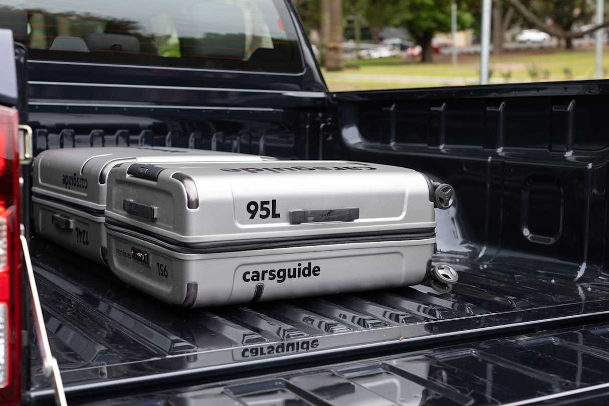 In both cars, things like school bags and grocery bags will slide around (pictured: BT-50, image: Dean McCartney).