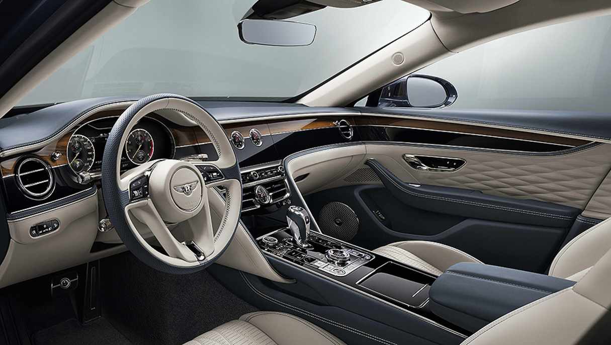 The 12.3-inch touchscreen hides behind a rotating veneer feature.