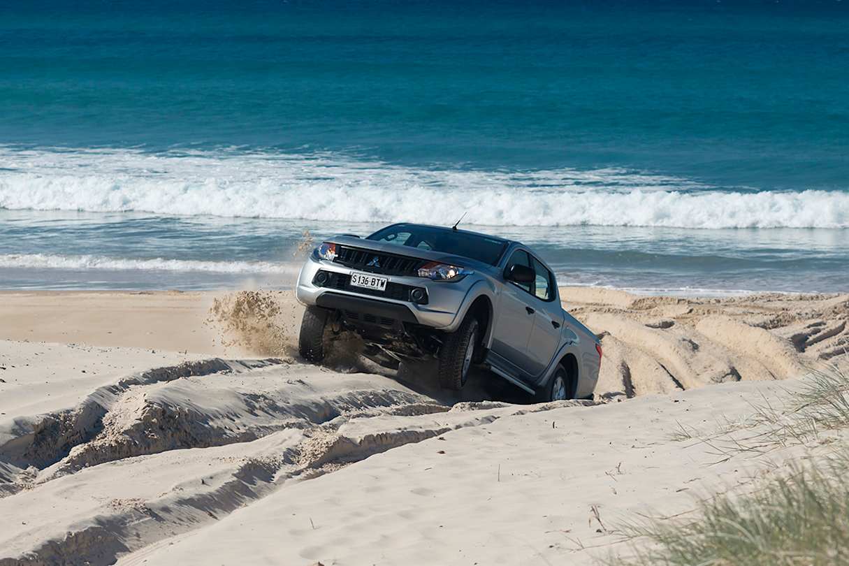 Drop tyre pressure to between 15 and 20 psi before you drive onto sand.