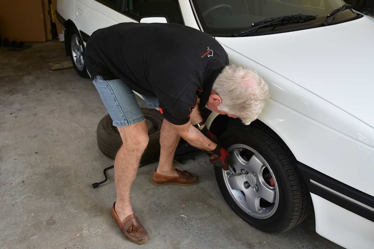 Remember to loosen the wheel nuts before lifting the car.