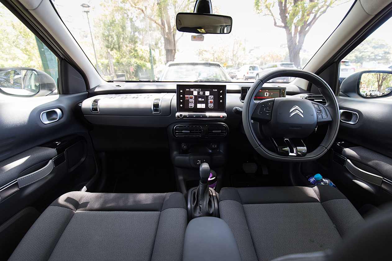 On the inside, it's fairly basic, with a standard dash, centre console and old school park brake situation.