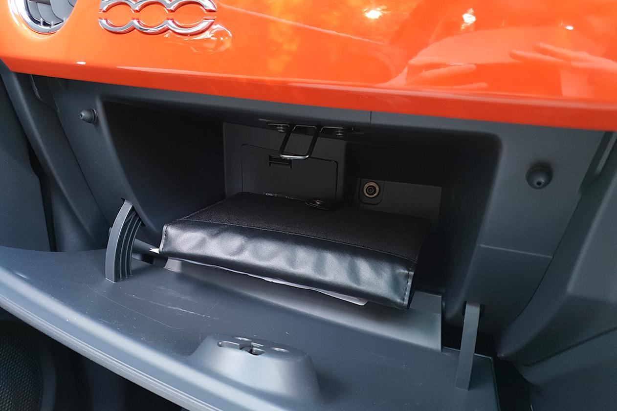 Spare room in the 500's glovebox is tiny, barely holding enough space for the owner's manual.