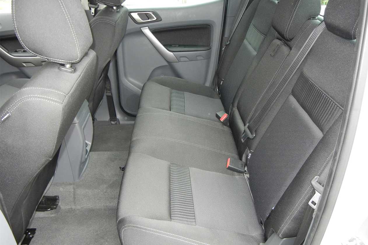 For dual cab models, rear seat occupants get two cupholders in the fold-down centre armrest. (XLT model shown)