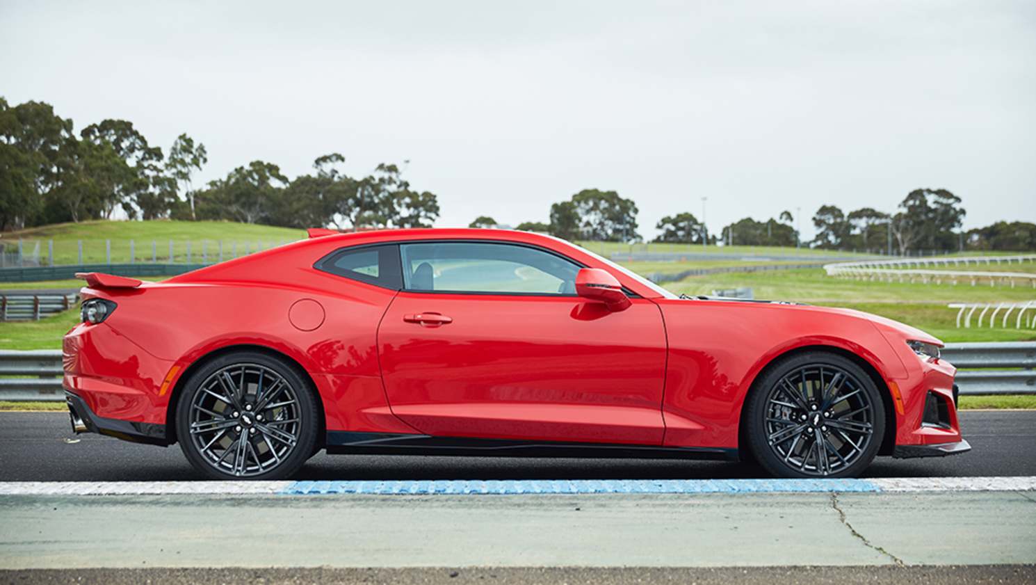 The body changes were subjected to more than 100 hours of wind-tunnel testing to improve aerodynamics and cooling for track use.