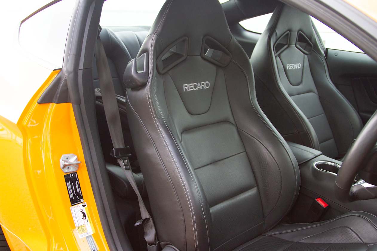 Up front, you get a small bin under the armrest, bottle holders in the doors, and a glove box with room for things.