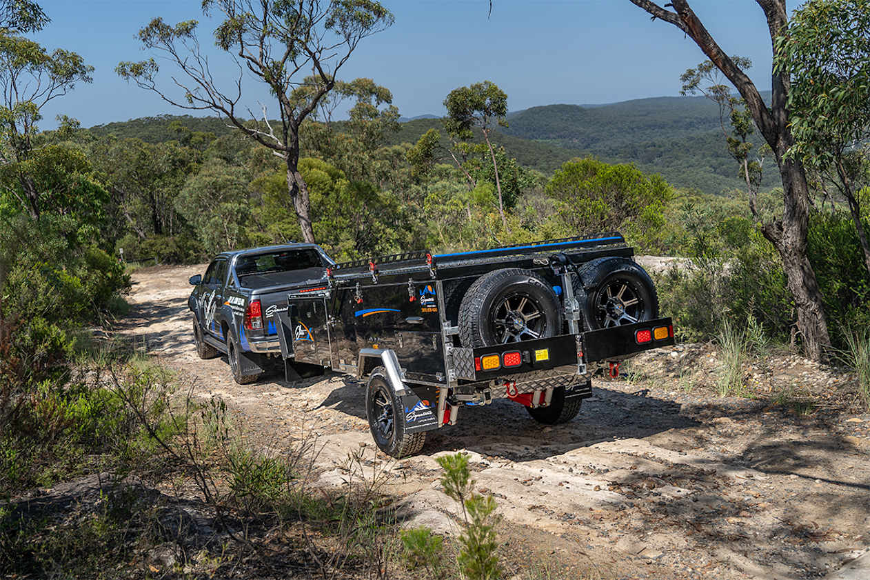 The small expedition trailer relies on a roof-top tent for accommodation.