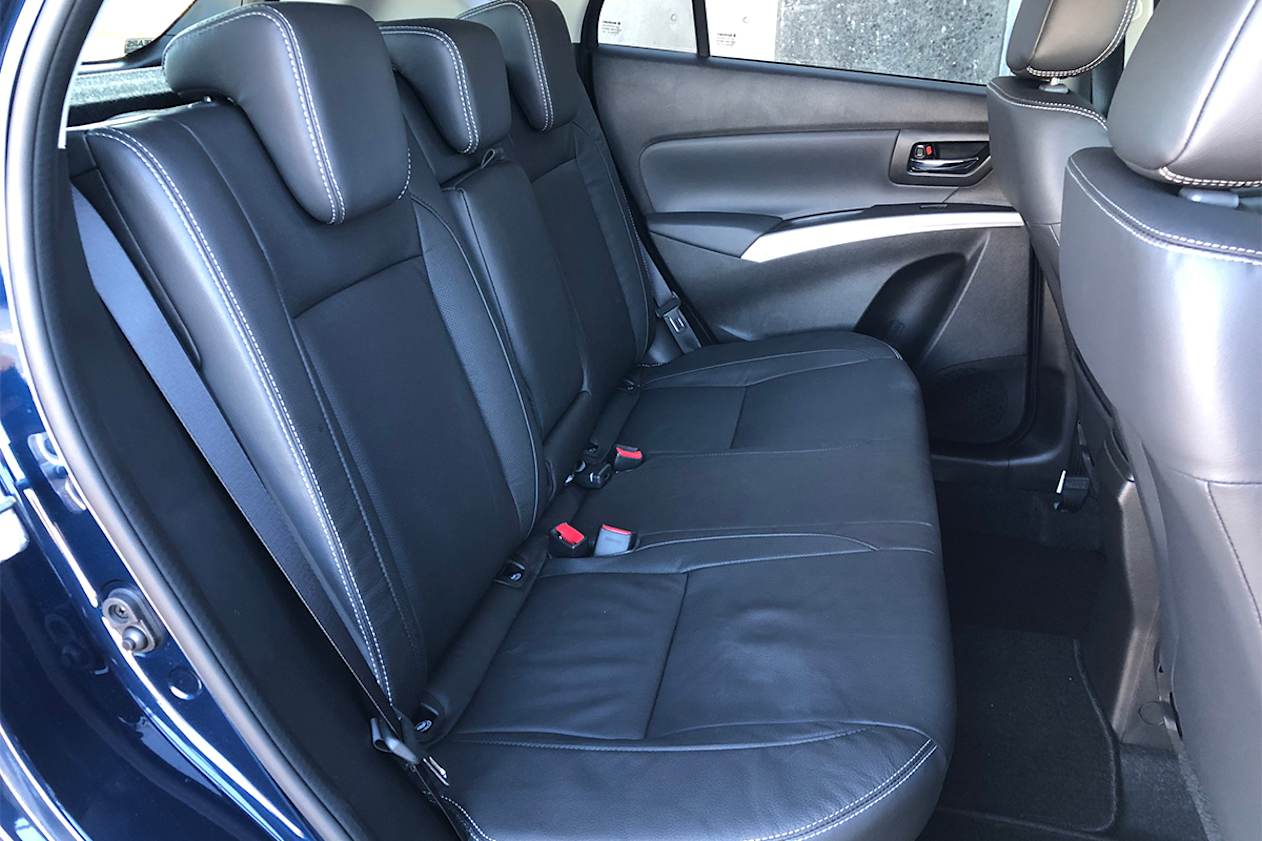 Even at 191cm tall I can sit behind my driving position with about 20mm of space between my knees and the seatback.