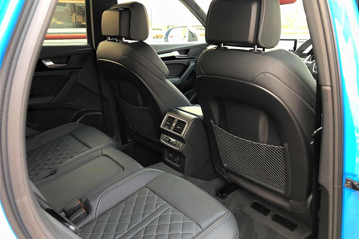 Sitting behind my driving position is a bit tight, with my knees almost up against the seat back.