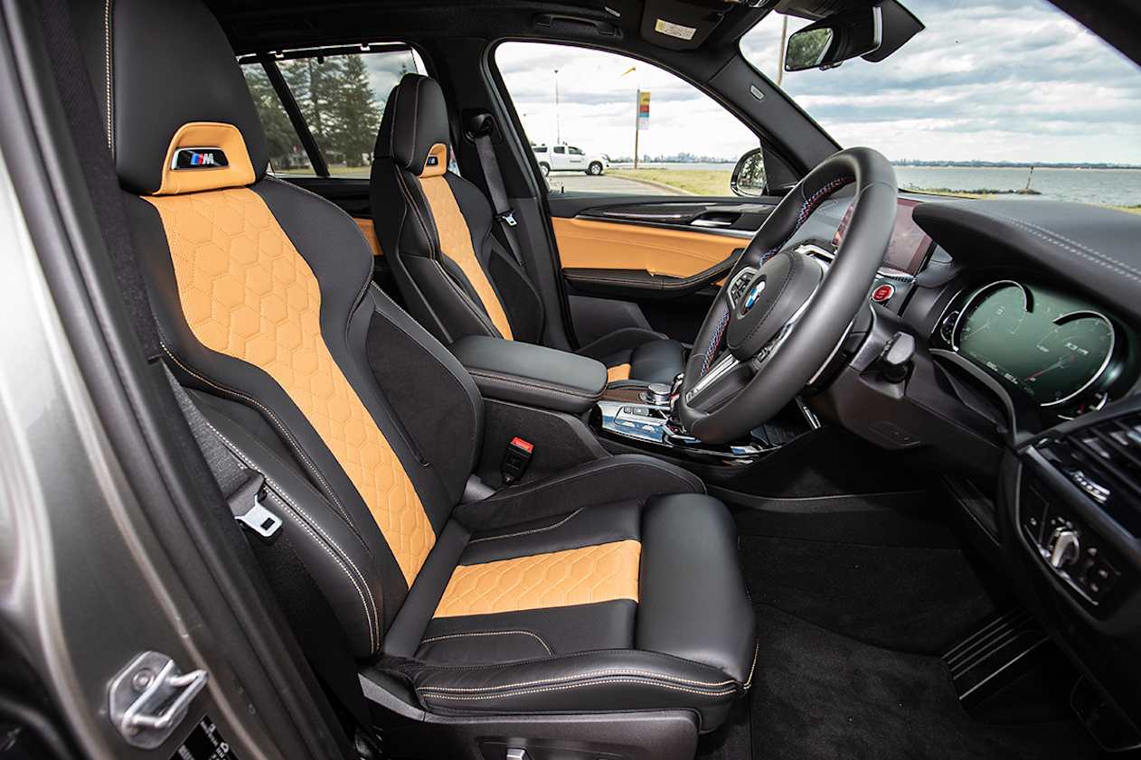 Front seat passengers score a pair of cupholders with a cover and the centre rear armrest has two more for a total of four. (image: Peter Anderson)