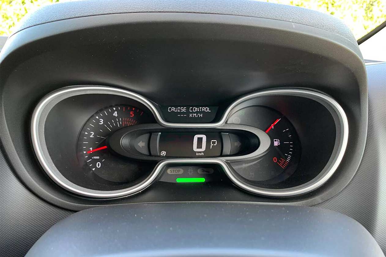 Behind the steering wheel sits a a digital speedometer. (LWB model shown)