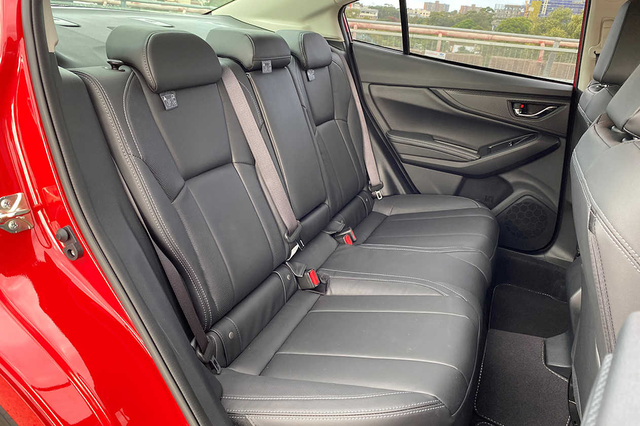 I still can sit behind my driving position in the sedan without my knees touching the seat back. (image: Richard Berry)